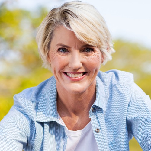 Adult Scoliosis Patients - middle aged woman smiling